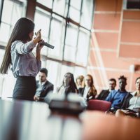 Business People Listening to the Public Speaker